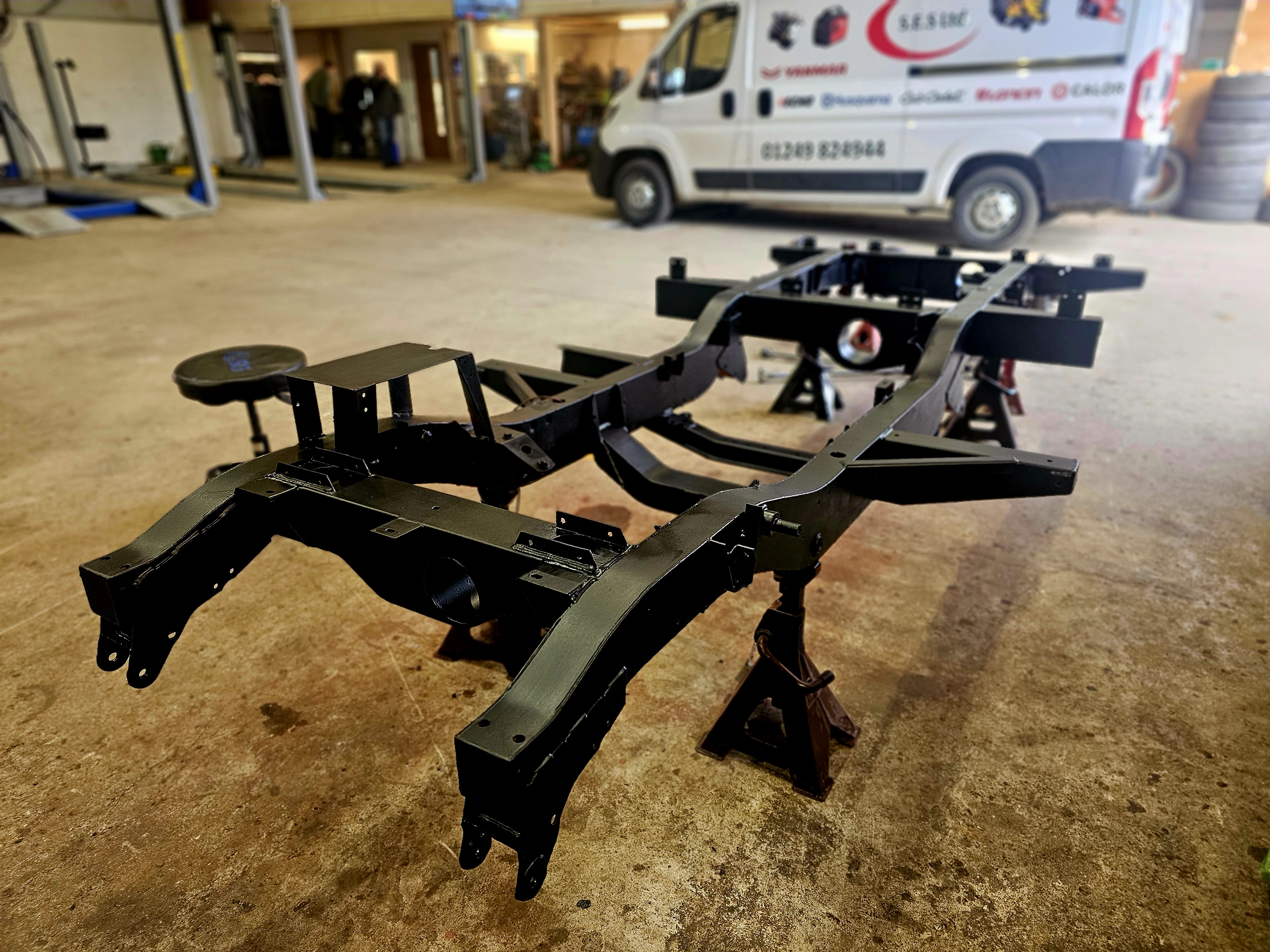 Freshly restored chassis frame inside the workshop
